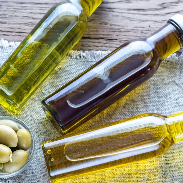 Bottles with different kinds of olive oil